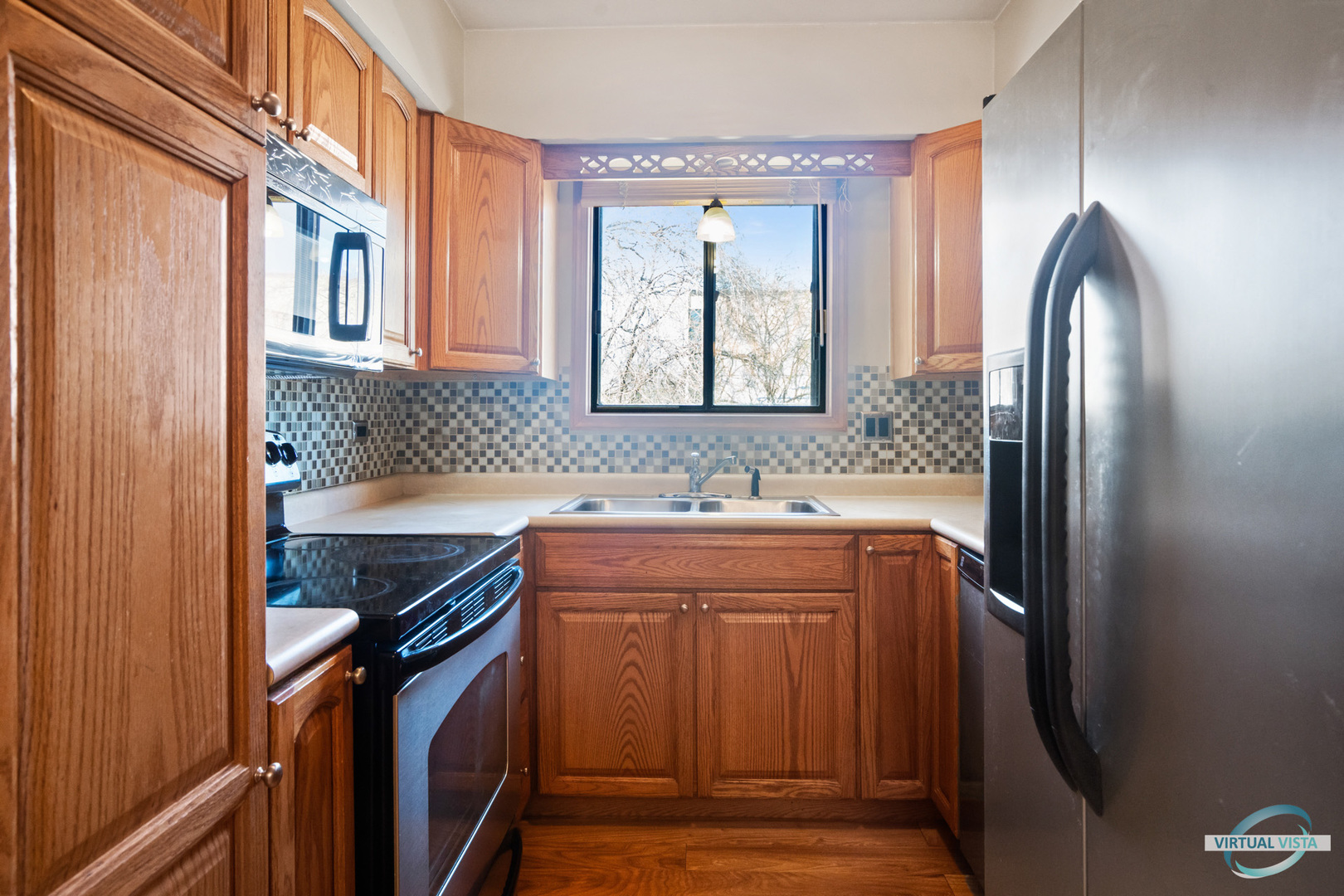 5746 106th Street, Unit 1E Chicago Ridge, IL 60415 - Photo 3 of 21 a bathroom with a granite countertop sink and a mirror