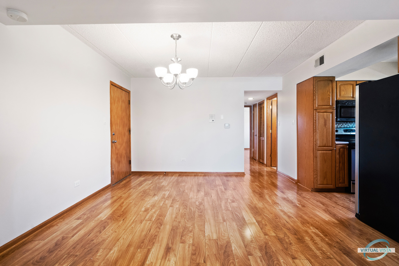 5746 106th Street, Unit 1E Chicago Ridge, IL 60415 - Photo 5 of 21 a view of empty room with wooden floor
