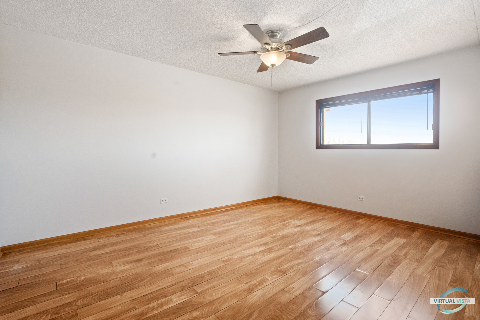5746 106th Street, Unit 1E Chicago Ridge, IL 60415 - Photo 9 of 21 a view of an empty room with wooden floor
