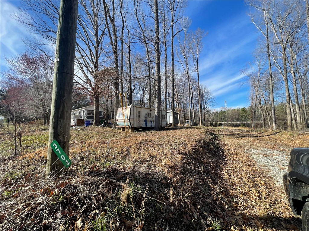 3605 West Ten Road Efland, NC 27243 - Photo 6 of 7 a view of outdoor space with wooden fence