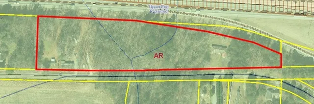 a view of swimming pool with a small yard and plants