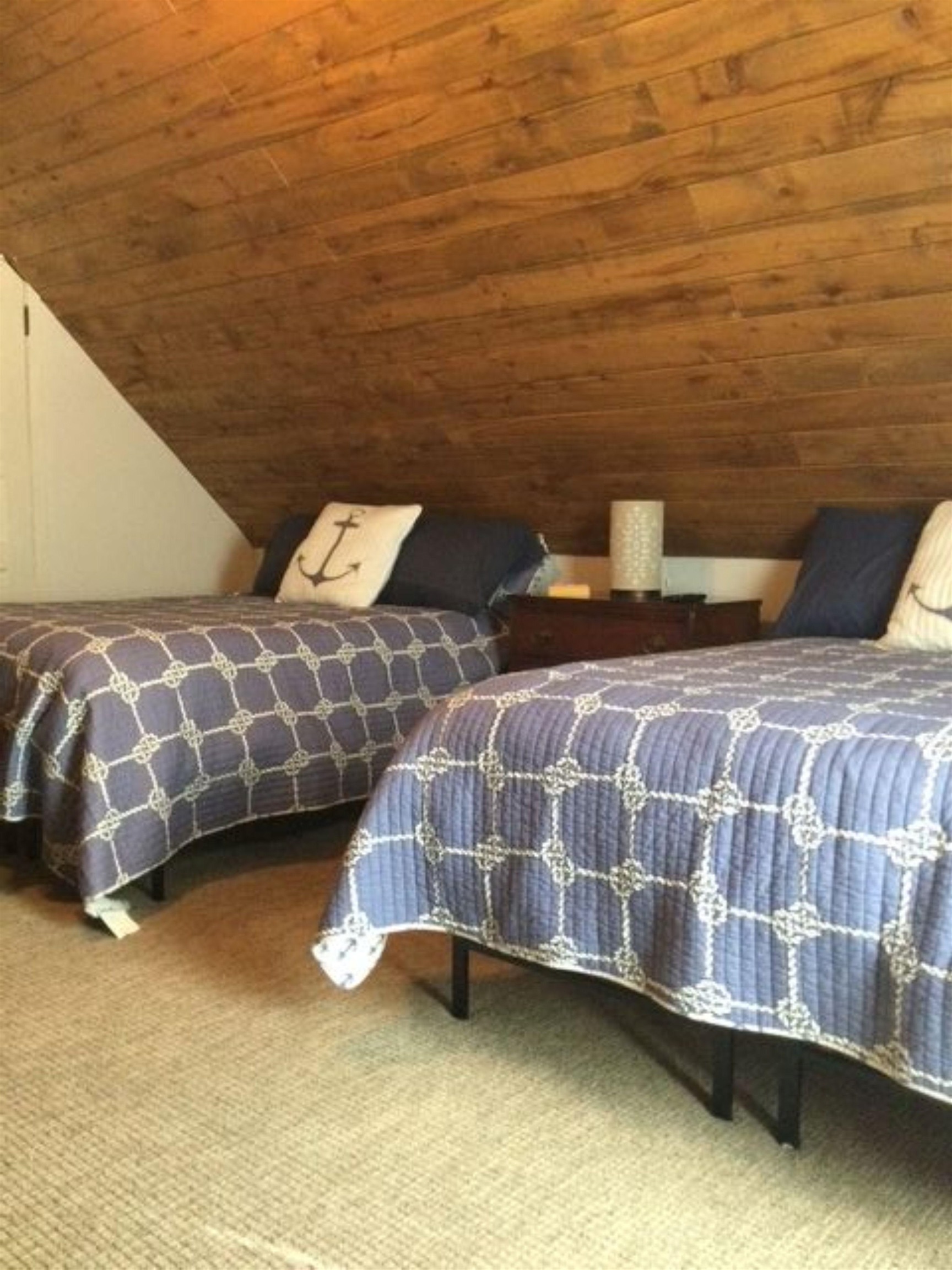 602 Sycamore Road Burnet, TX 78611 - Photo 22 of 26 a bedroom with a bed and a night stand
