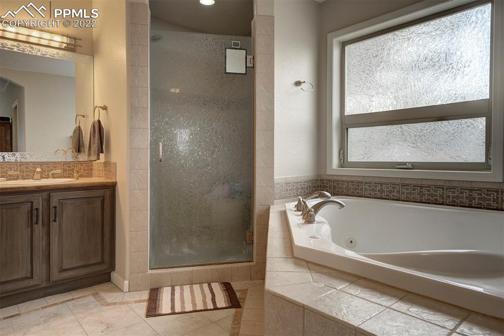30905 Ridge Road Ramah, CO 80832 - Photo 13 of 36 a bathroom with a bathtub and a shower