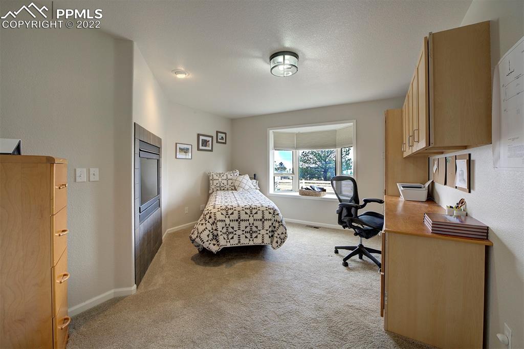 30905 Ridge Road Ramah, CO 80832 - Photo 15 of 36 a living room with furniture and a flat screen tv