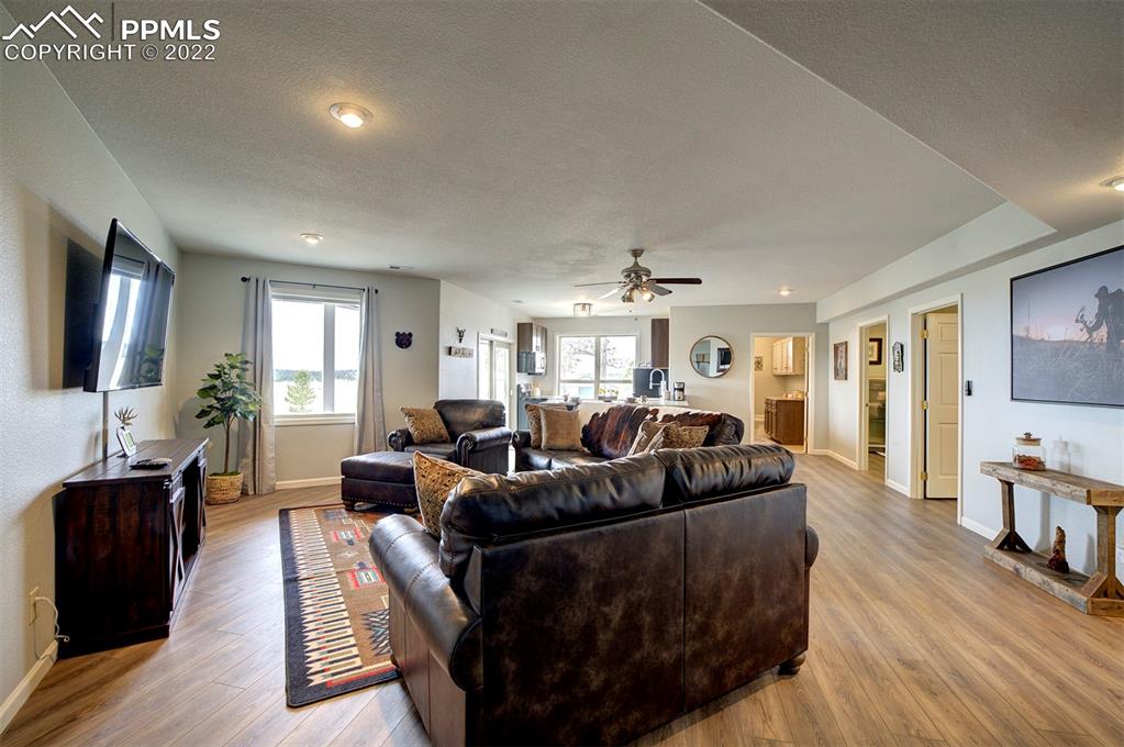 30905 Ridge Road Ramah, CO 80832 - Photo 20 of 36 a living room with furniture and a flat screen tv