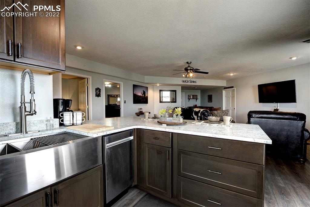 30905 Ridge Road Ramah, CO 80832 - Photo 21 of 36 a kitchen with a sink stainless steel appliances and cabinets