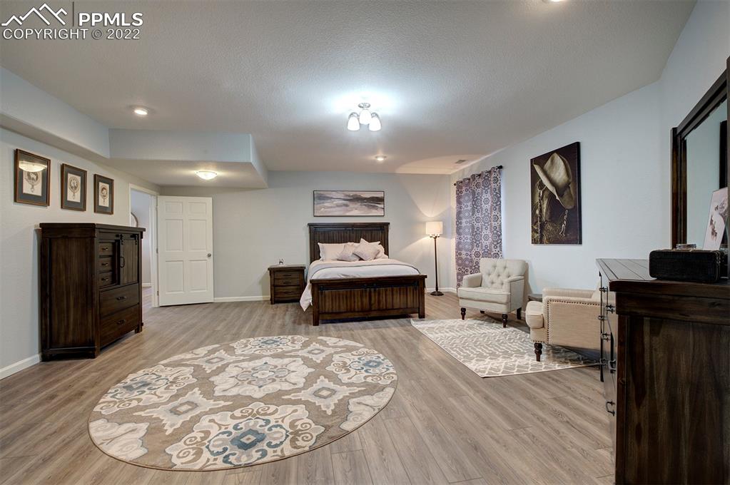 30905 Ridge Road Ramah, CO 80832 - Photo 23 of 36 a living room with furniture and a fireplace