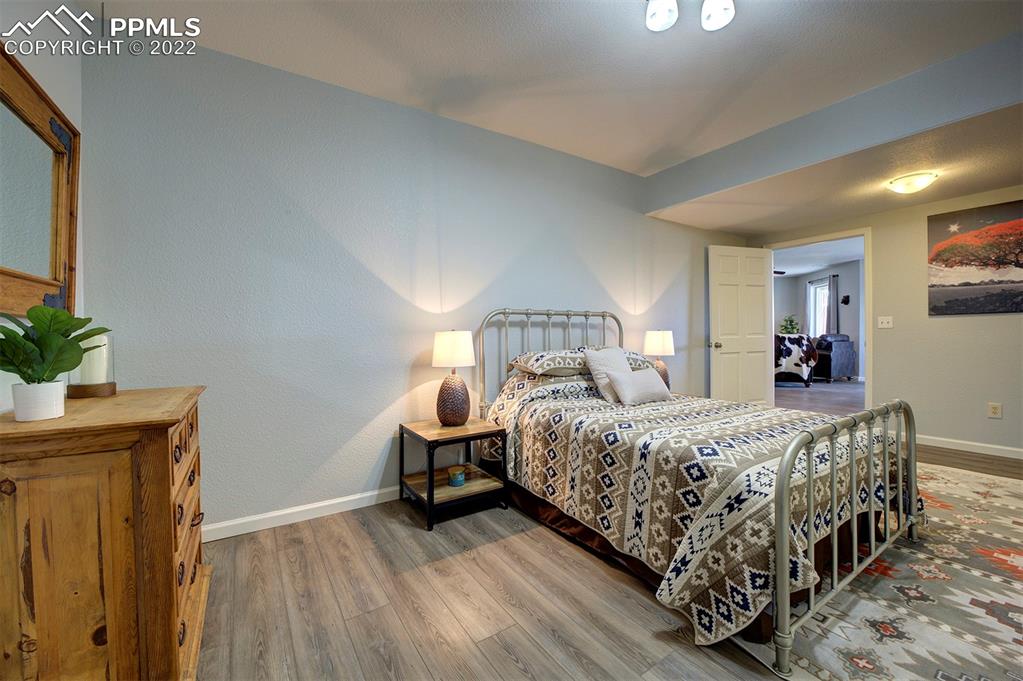 30905 Ridge Road Ramah, CO 80832 - Photo 24 of 36 a bedroom with a bed and a potted plant