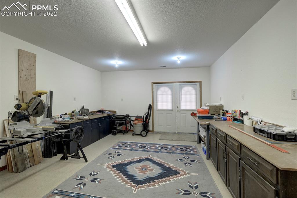 30905 Ridge Road Ramah, CO 80832 - Photo 26 of 36 a kitchen with a sink stove and wooden cabinets