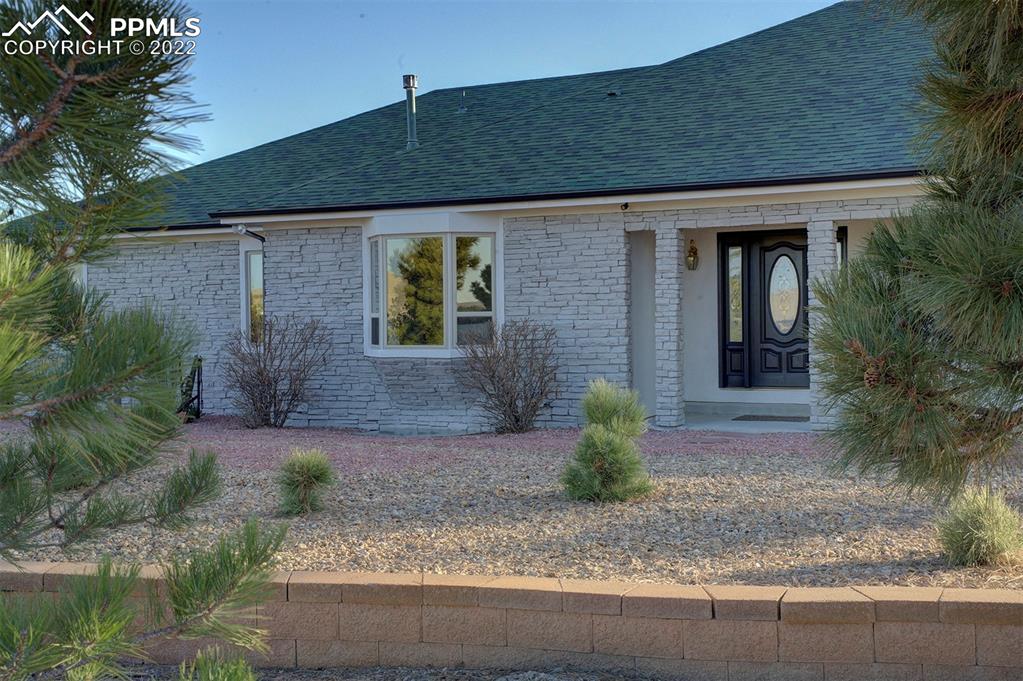 30905 Ridge Road Ramah, CO 80832 - Photo 36 of 36 a front view of a house with garden