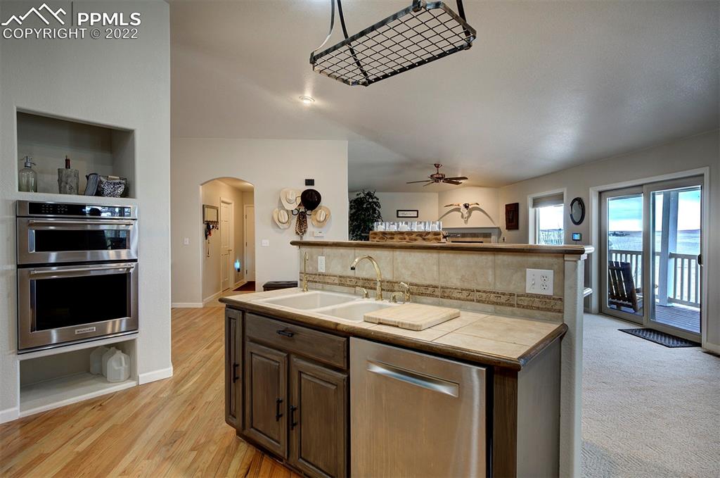 30905 Ridge Road Ramah, CO 80832 - Photo 6 of 36 a kitchen with stainless steel appliances granite countertop a sink and stove