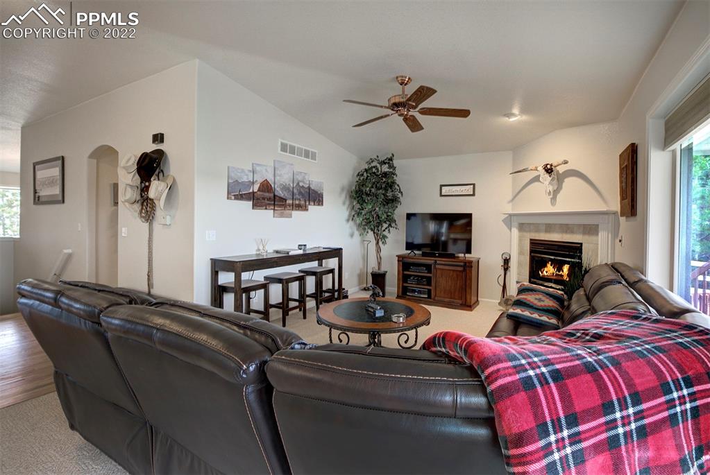 30905 Ridge Road Ramah, CO 80832 - Photo 7 of 36 a living room with furniture a fireplace and a flat screen tv