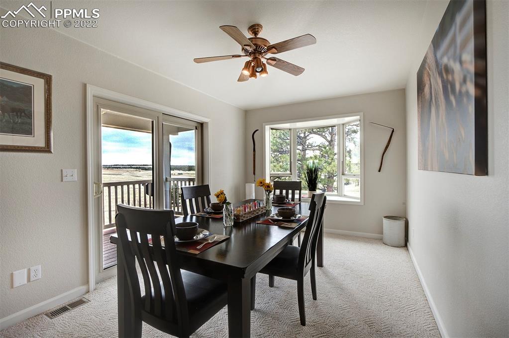 30905 Ridge Road Ramah, CO 80832 - Photo 8 of 36 a view of a dining room with furniture window and outside view