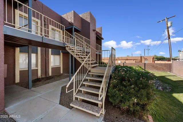 a view of a building with a yard