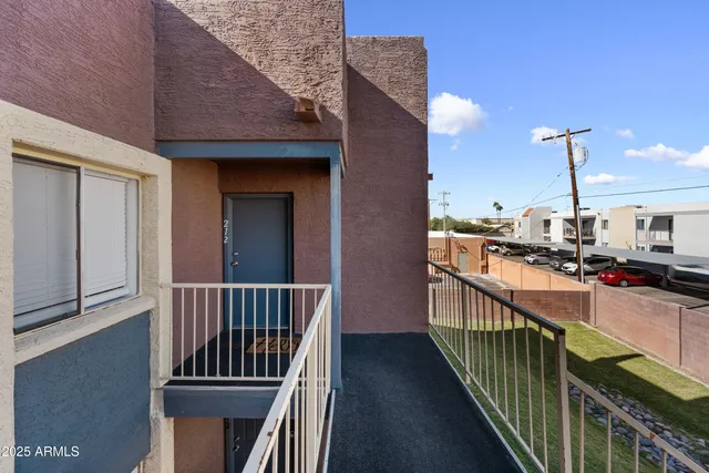 a view of balcony with yard