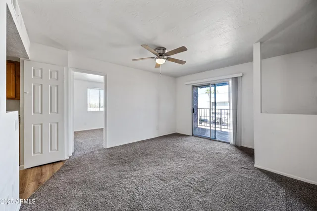 a view of an empty room with a window