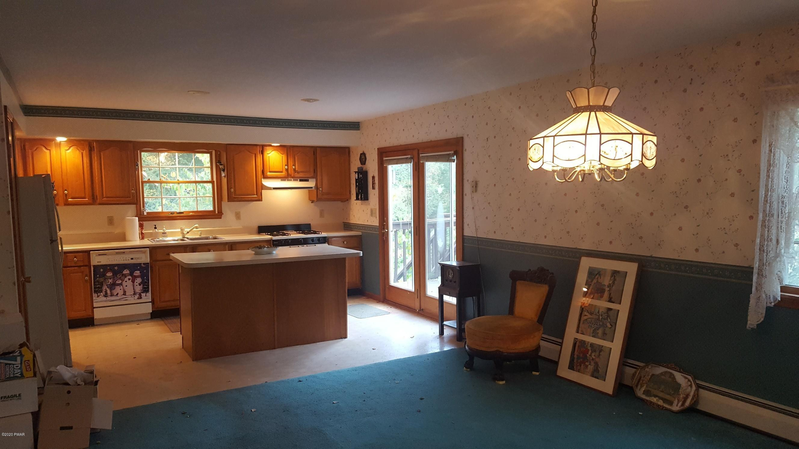 554 St Tikhons Road Waymart, PA 18472 - Photo 8 of 29 a kitchen with sink refrigerator and window