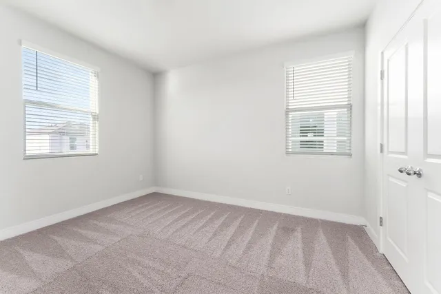 a spacious bathroom with a double vanity sink mirror and double