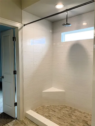 a bathroom with double vanity sinks and a mirror