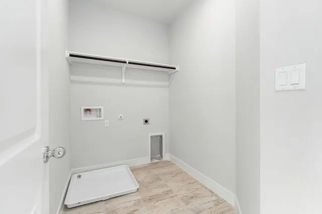 a view of an empty room and closet area