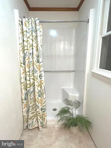 a bedroom with bed and window