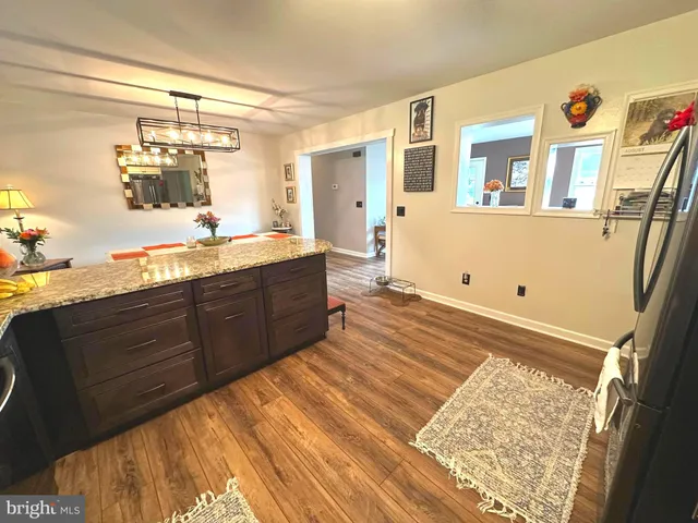 a bathroom with a sink a toilet and shower curtain