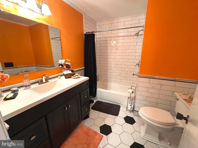 a view of a house with a big yard and large trees