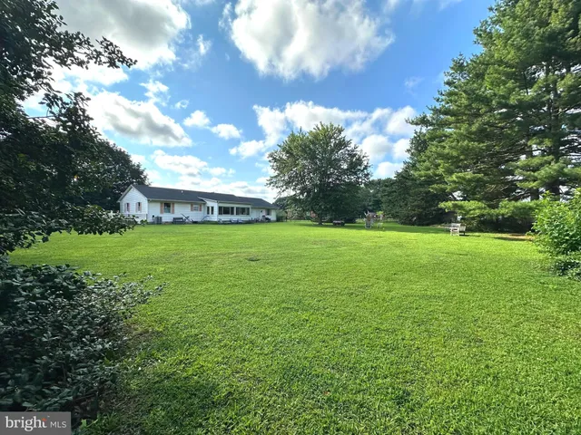 a view of a house with a big yard