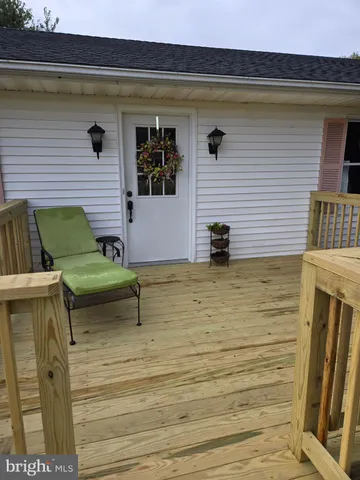 a view of a barn in the back yard