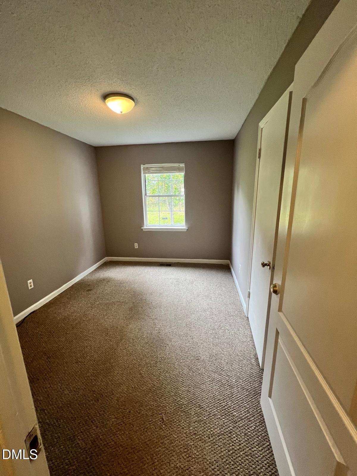 1111 Penzance Avenue Durham, NC 27704 - Photo 13 of 18 an empty room with windows