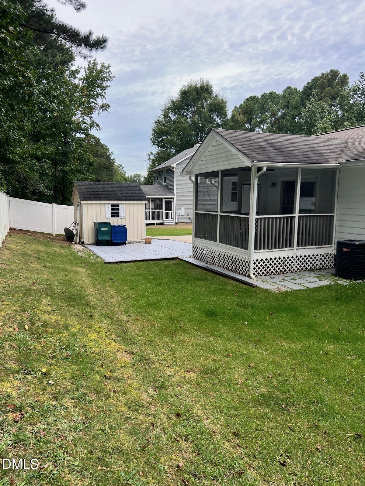 1111 Penzance Avenue Durham, NC 27704 - Photo 18 of 18 a view of a house with a yard and sitting area