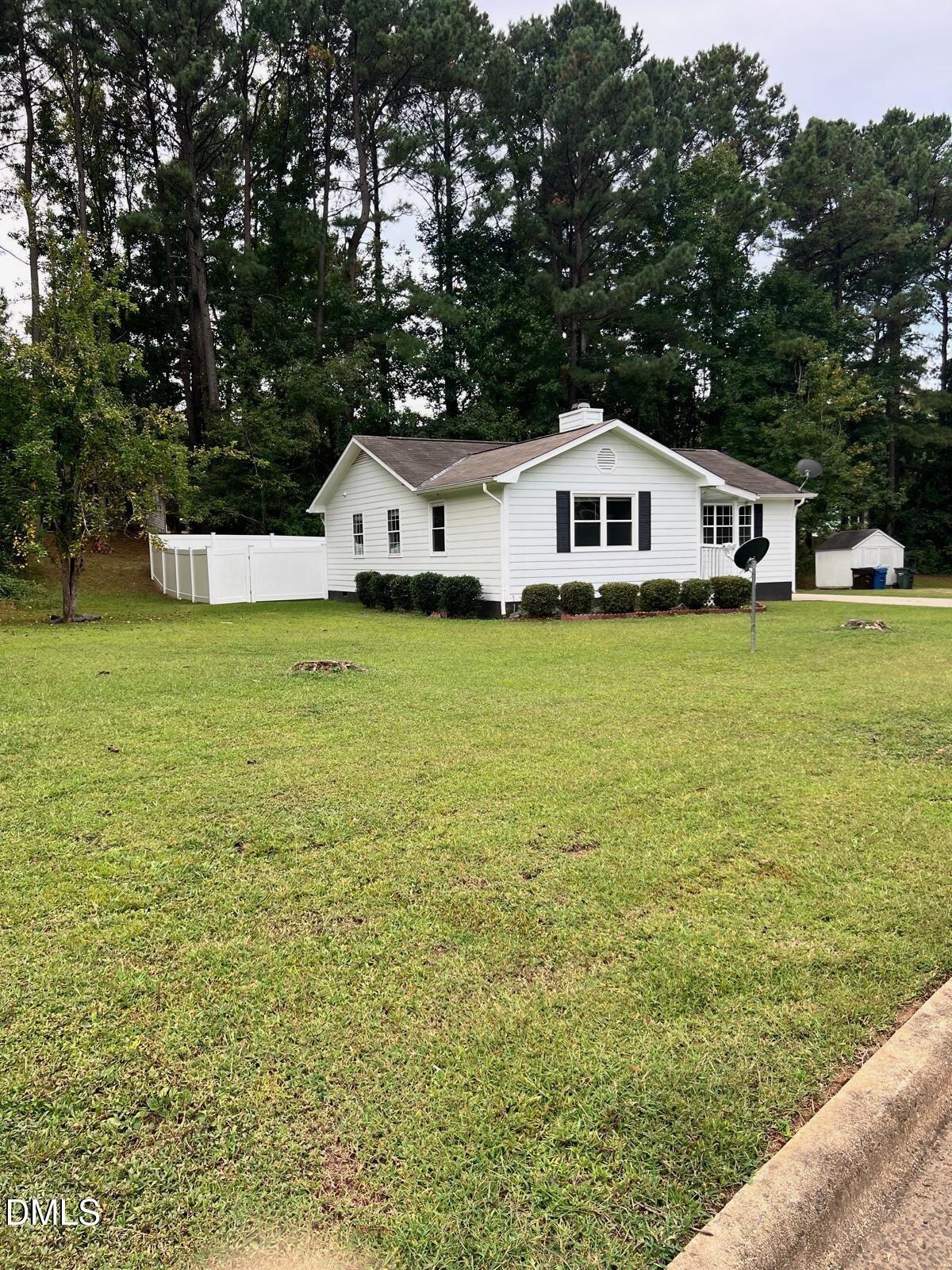 1111 Penzance Avenue Durham, NC 27704 - Photo 2 of 18 a front view of a house with a yard
