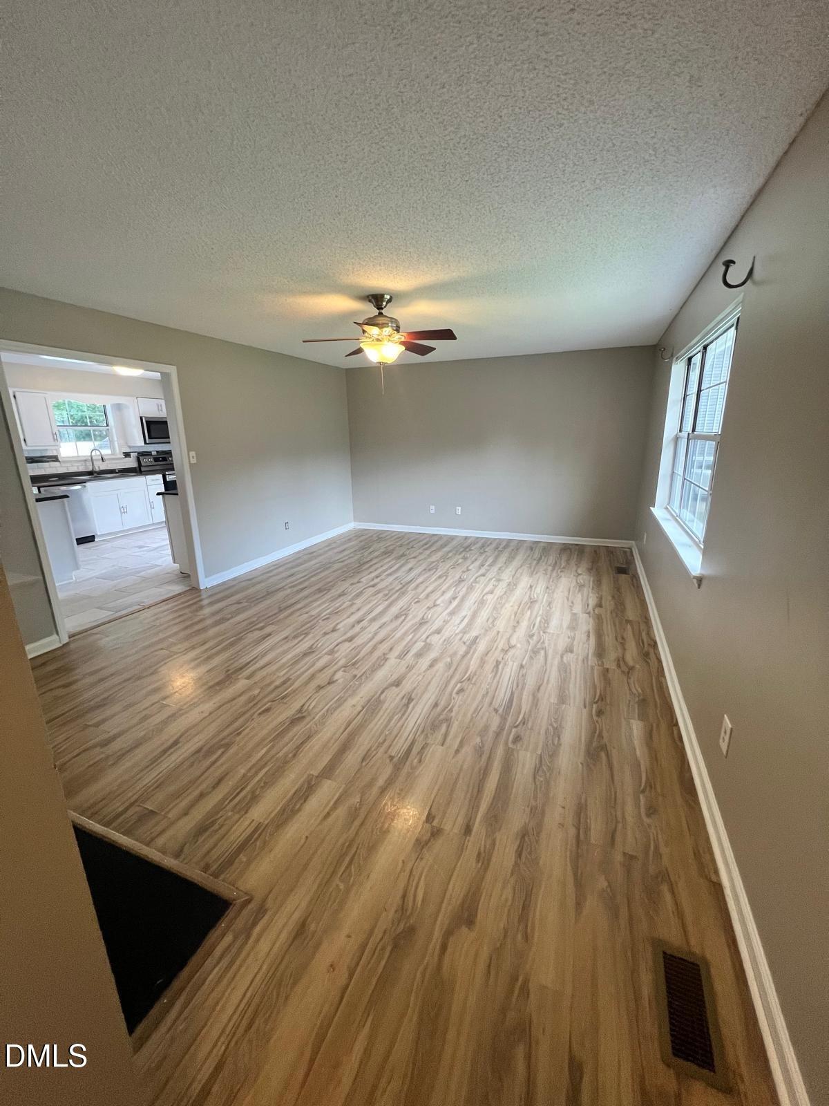 1111 Penzance Avenue Durham, NC 27704 - Photo 3 of 18 a view of a room with wooden floor