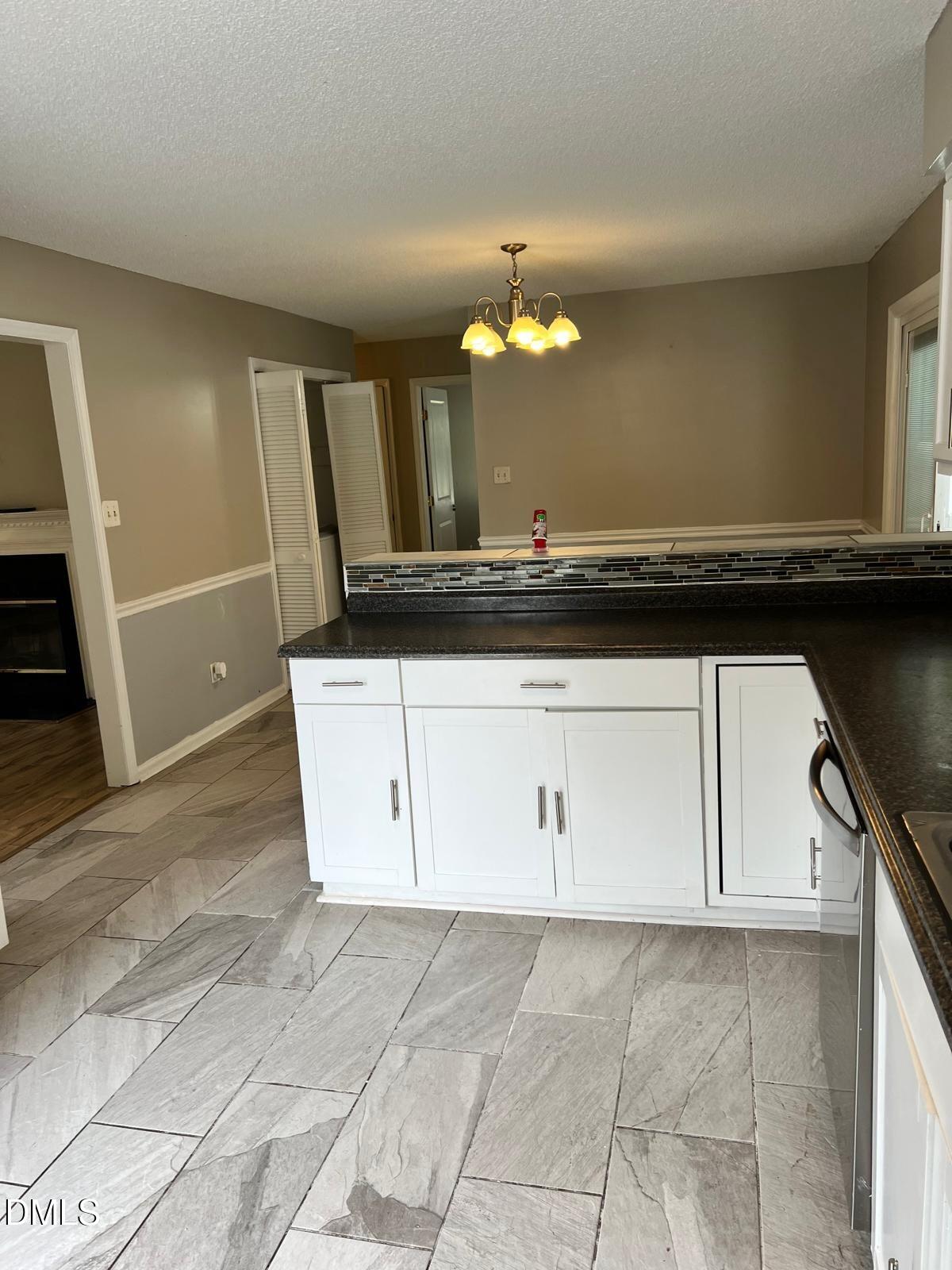1111 Penzance Avenue Durham, NC 27704 - Photo 6 of 18 a view of cabinets with wooden floor