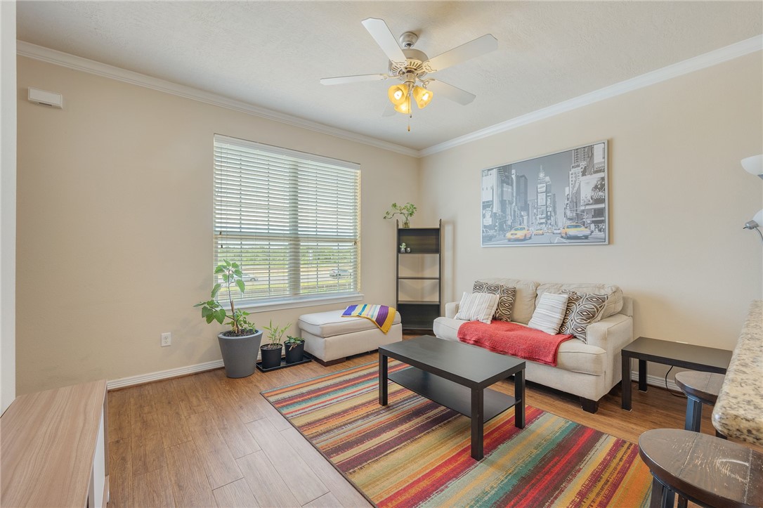 1198 Jones-Butler Road, Unit 3110 College Station, TX 77840 - Photo 2 of 16 a living room with furniture and a window