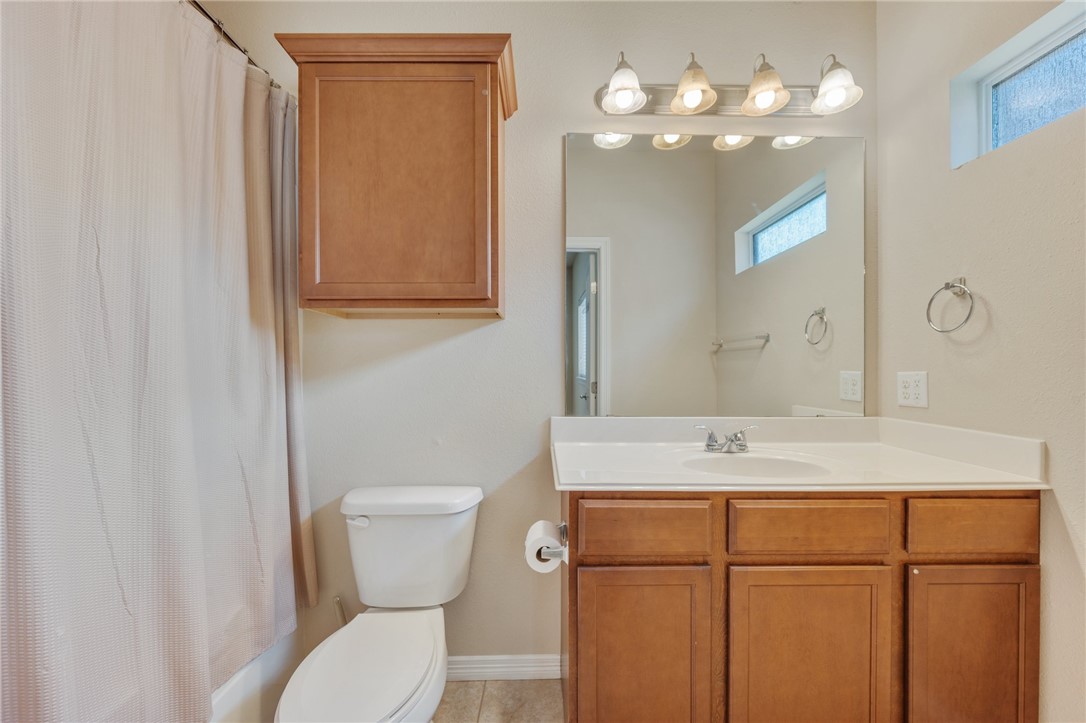 1198 Jones-Butler Road, Unit 3110 College Station, TX 77840 - Photo 8 of 16 a bathroom with a toilet sink and mirror