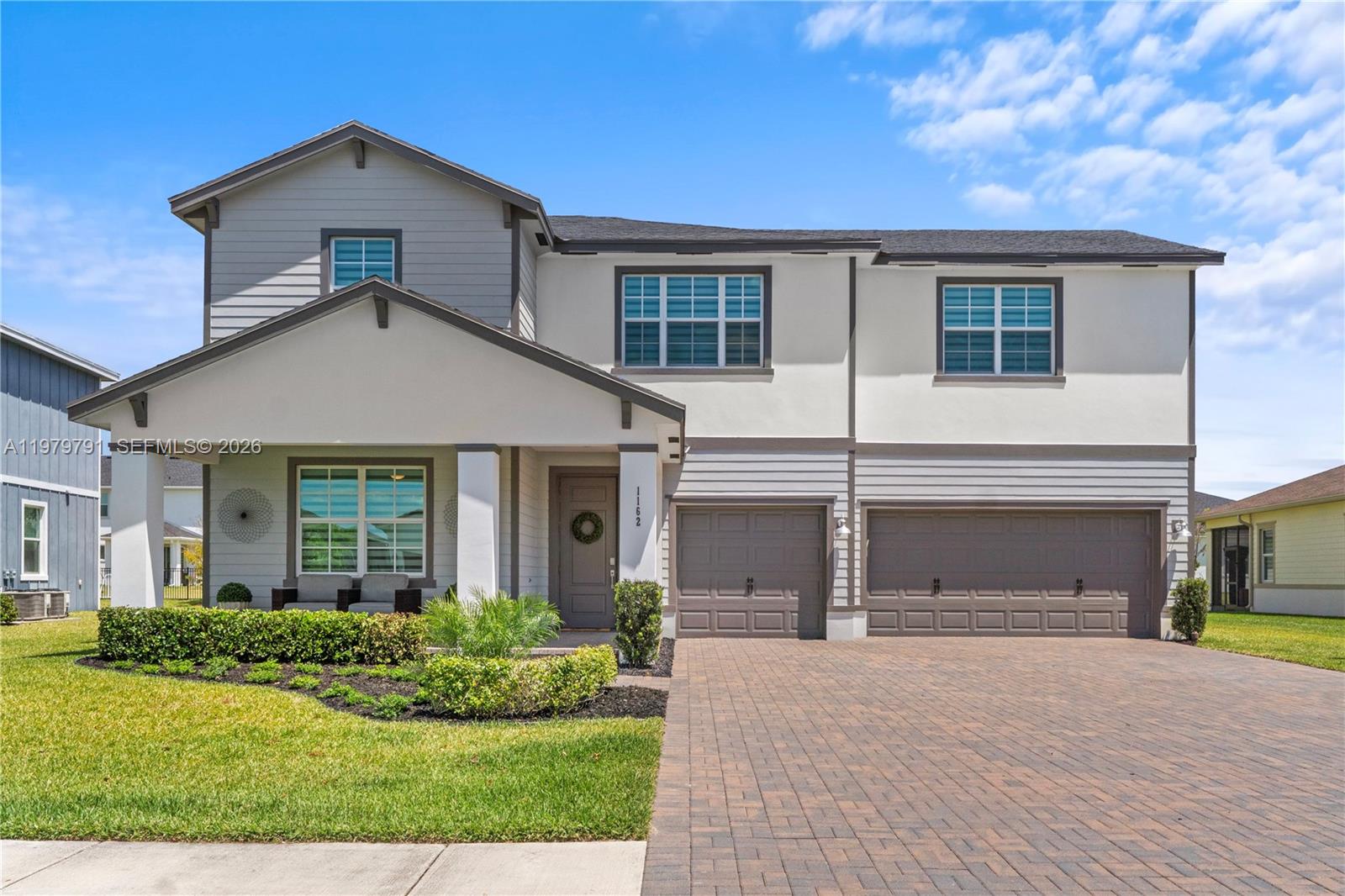 1162 Haywagon Trail Loxahatchee, FL 33470 - Photo 2 of 50 front view of a house with a yard
