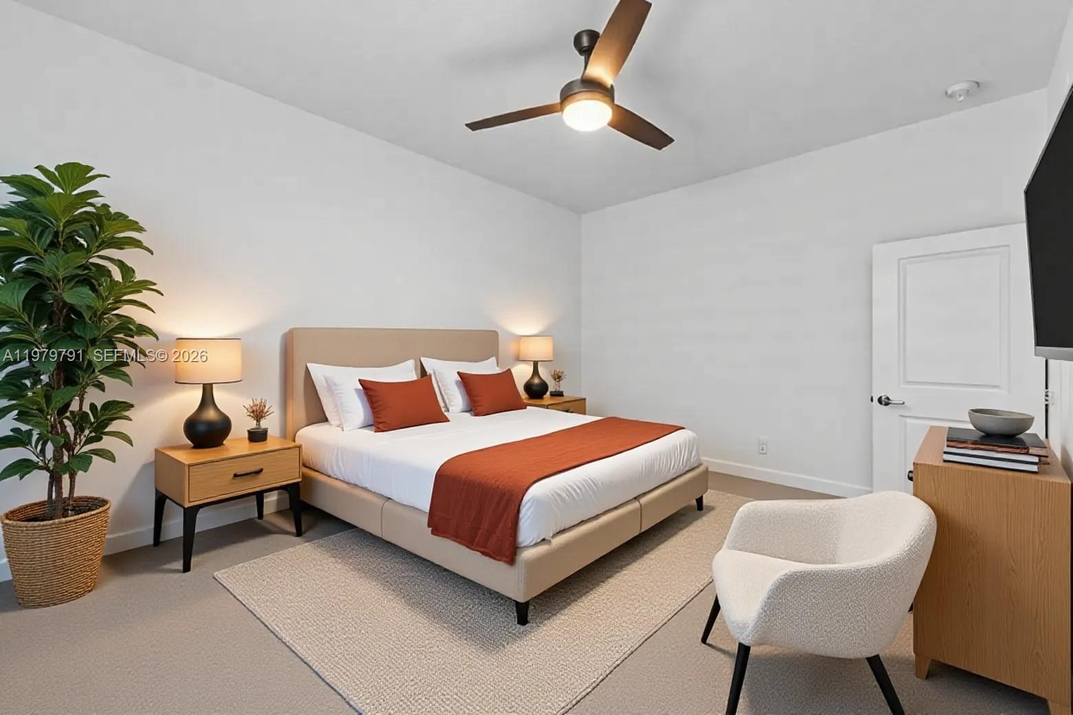 1162 Haywagon Trail Loxahatchee, FL 33470 - Photo 21 of 50 a bedroom with bed and a chair