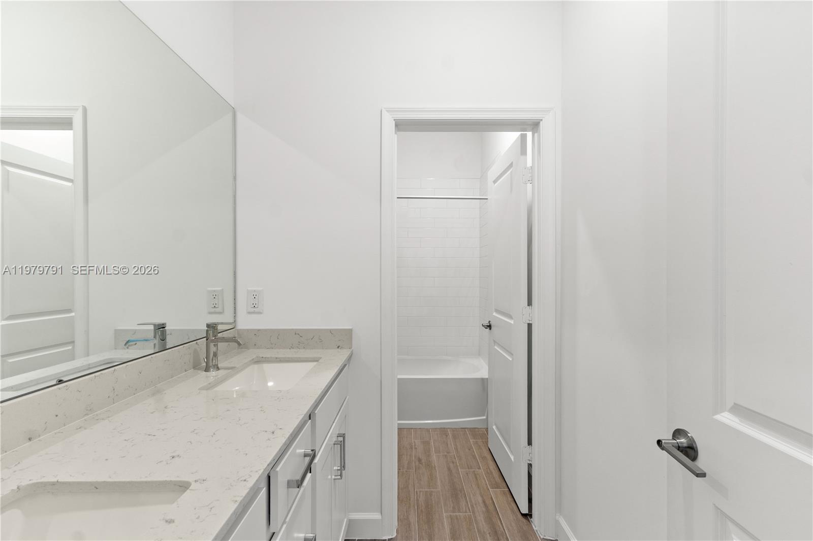 1162 Haywagon Trail Loxahatchee, FL 33470 - Photo 31 of 50 a bathroom with a granite countertop sink and a mirror