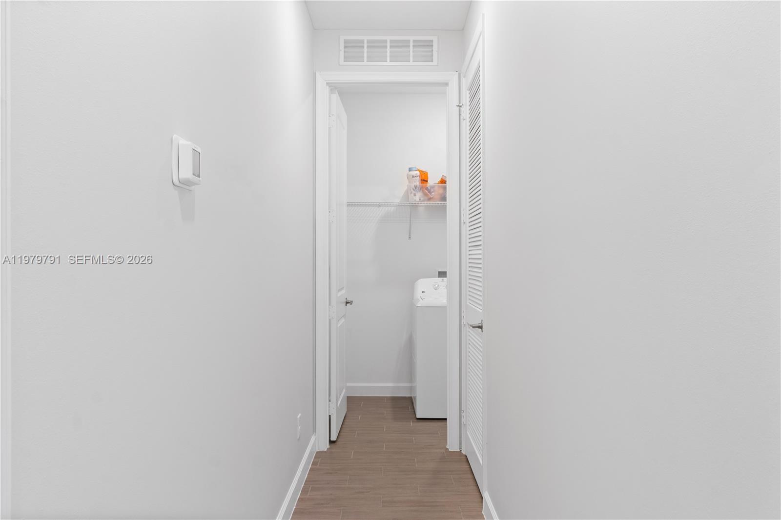1162 Haywagon Trail Loxahatchee, FL 33470 - Photo 32 of 50 a view of a bathroom from a hallway