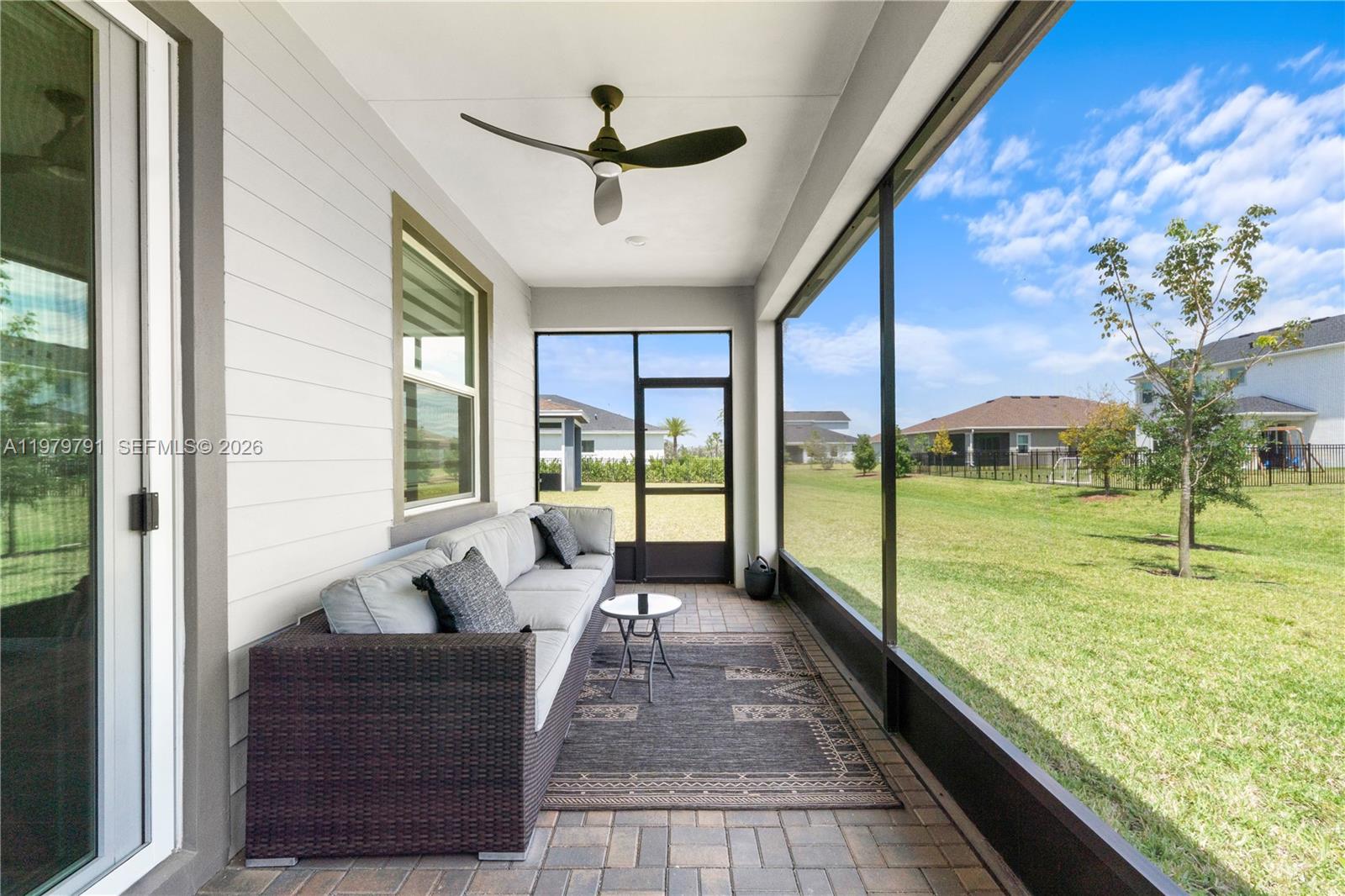 1162 Haywagon Trail Loxahatchee, FL 33470 - Photo 34 of 50 a living room with hardwood floor and a garden