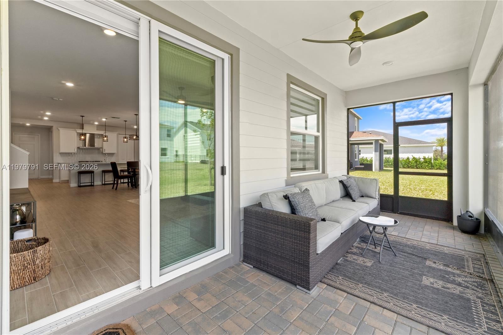1162 Haywagon Trail Loxahatchee, FL 33470 - Photo 35 of 50 a living room with furniture and a large window