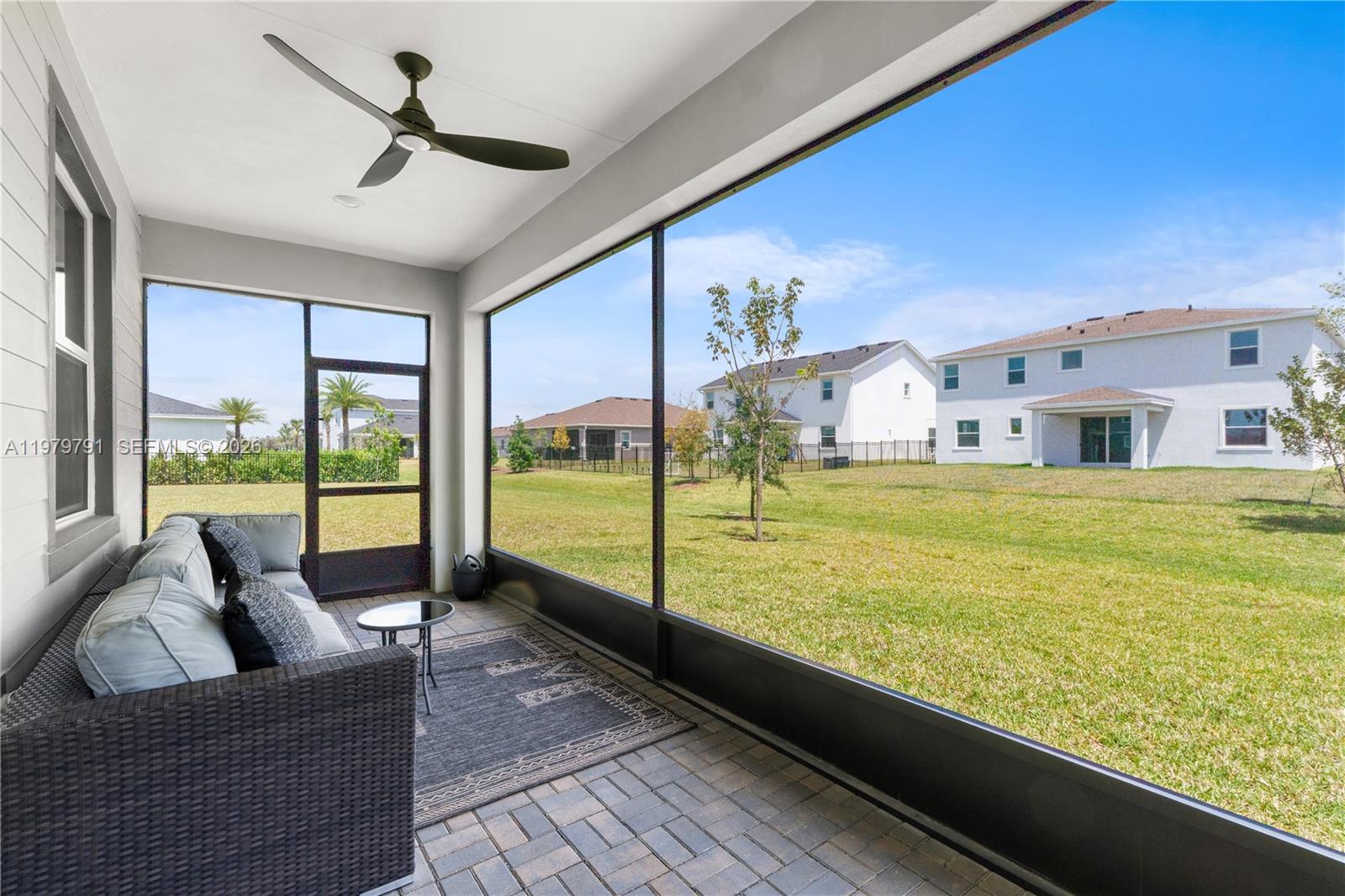 1162 Haywagon Trail Loxahatchee, FL 33470 - Photo 36 of 50 a living room with large pool table furniture and floor to ceiling windows