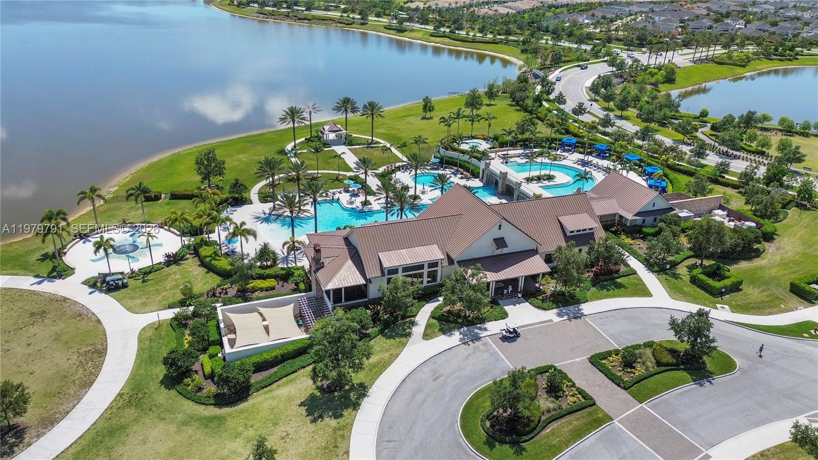 1162 Haywagon Trail Loxahatchee, FL 33470 - Photo 39 of 50 an aerial view of a house with a lake view