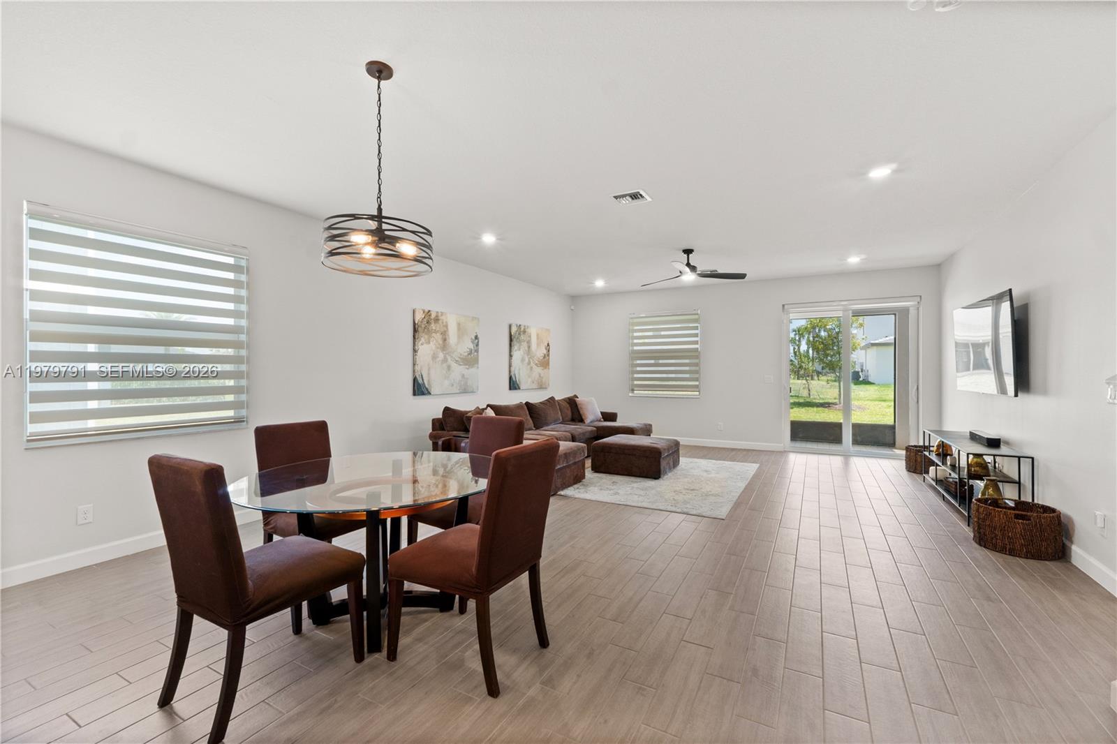 1162 Haywagon Trail Loxahatchee, FL 33470 - Photo 7 of 50 a view of a dining room with furniture window and outside view