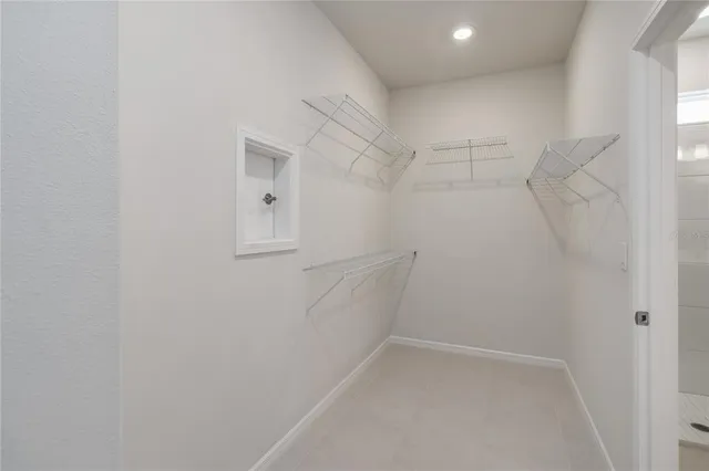 a bathroom with a toilet sink and a mirror