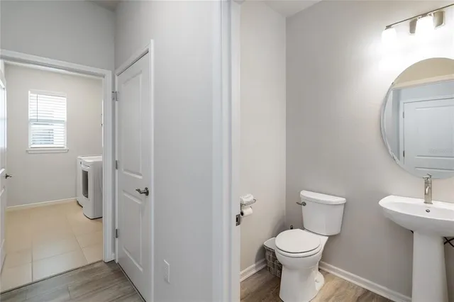 a view of a bathroom from a hallway