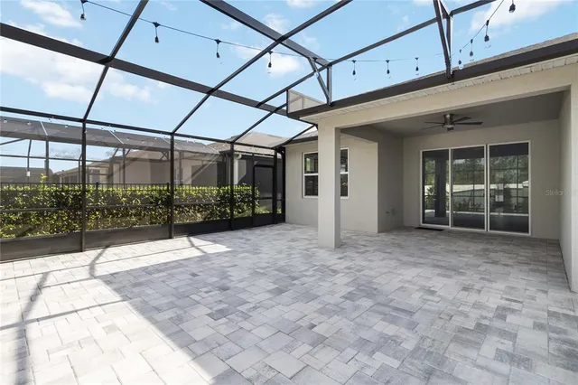 a view of yard with swimming pool and trees