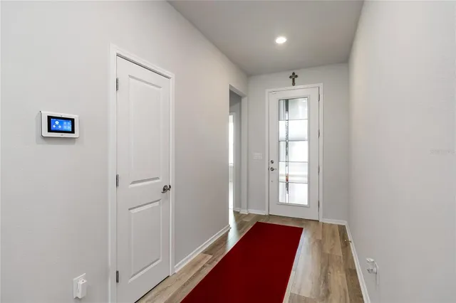 a view of front door with wooden floor