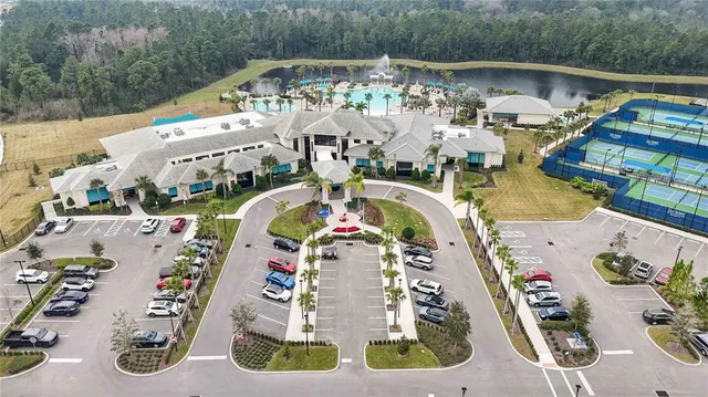 an aerial view of a house with a swimming pool